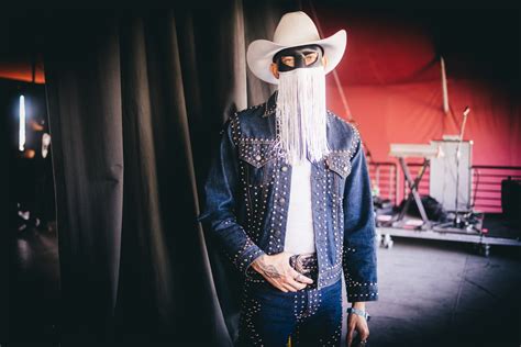 The Secrets Behind Orville Peck's Shadowed Gaze: An Intimate Look into his Craft